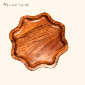 Round wooden dinner plate made from solid mango wood with natural brown finish for serving food.